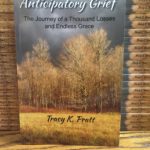 Trees in autumn as a background for the book title Anticipatory Grief